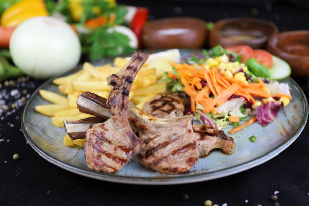Grilled lamb chops on a plate stock photo