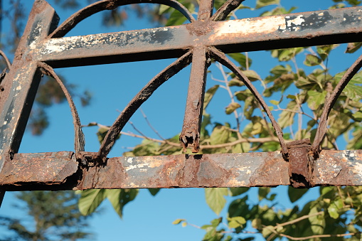 change concept. rusty gate. Old iron gate completely damaged by rust. concept of old and bad that needs to be changed