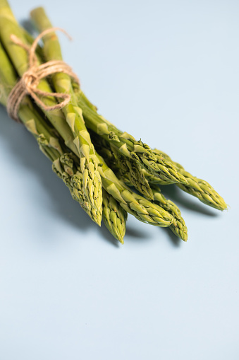 Asparagus on a blue background. Healthy food. Vegan food. Detox. Keto Diet.