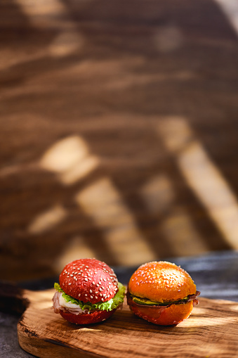 mini burgers, finger food on a wooden board.