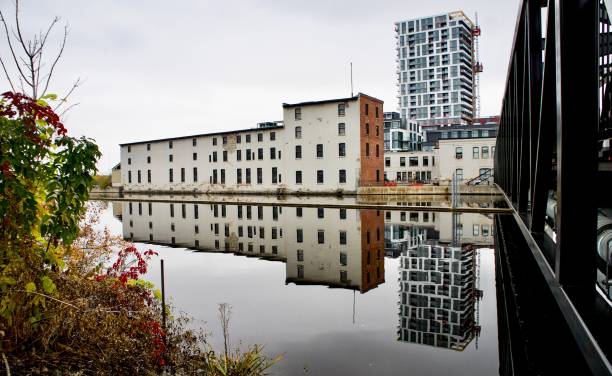 Urban Fall scene repurposed building reflecting on the water.