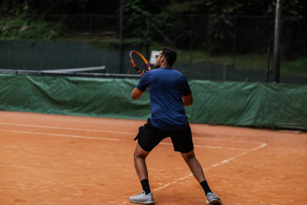 istock Young man playing tennis 1759819849