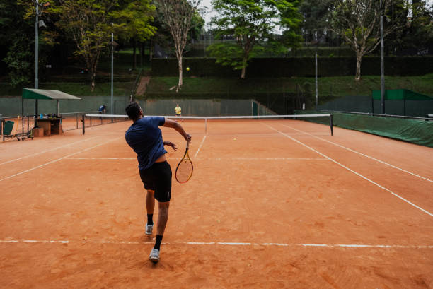 istock Young man playing tennis 1759819880