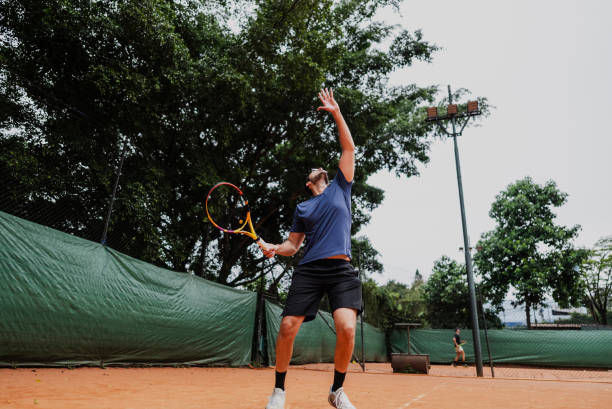 istock Young man playing tennis 1759819891