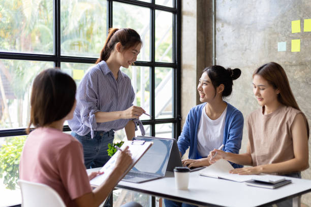 istock Group of colleagues at work are discussing and exchanging ideas in office having casual discussion during meeting in conference room. Group of university students working together in the library. 1759828868