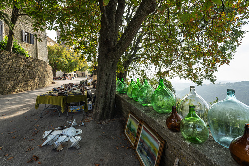 Groznjan, Croatia - October 12, 2023: Flea market and old stoned street with artistic shops