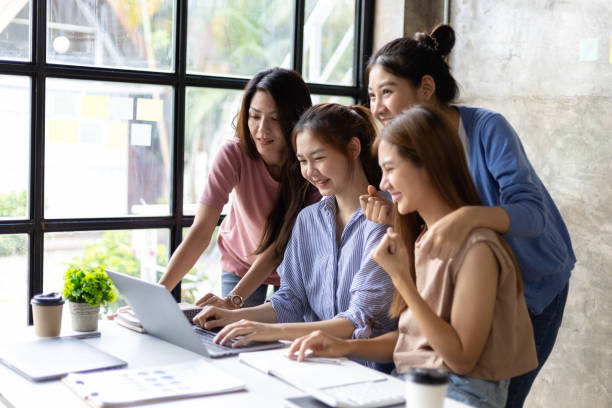 istock Colleagues meeting to discuss work plan on laptop in office. Group of university students working together in the library. 1759833078