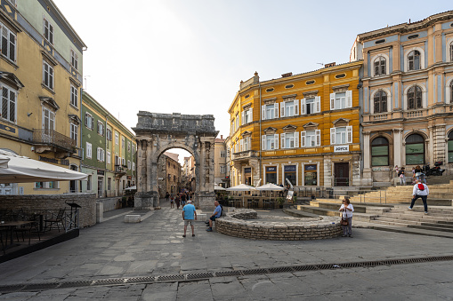 Pula, Croatia - October 9, 2023: The Triumphal Arch of the Sergii in Pula. Late Hellenistic Roman building. Golden Gate.