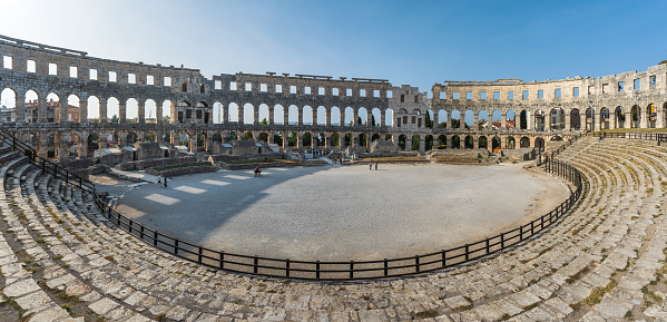 Pula, Croatia - October 9, 2023: Roman amphitheatre in Pula. It was constructed in 27 BC - 68 AD and is among six largest surviving Roman arenas in the World. Pula Arena is best preserved ancient monument in Croatia.