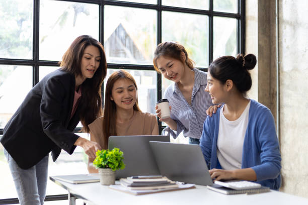 istock Colleagues meeting to discuss work plan on laptop in office. Group of university students working together in the library. 1759835321