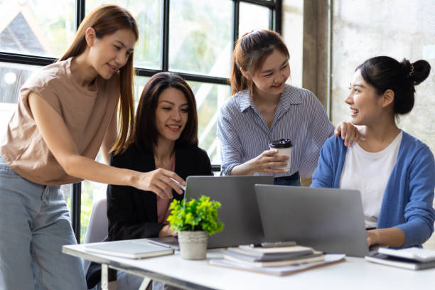 istock Group of colleagues at work are discussing and exchanging ideas in office having casual discussion during meeting in conference room. Group of university students working together in the library. 1759836437