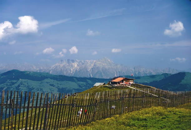 view across the Hochzeller alp on the mountain Schmittenhigh onto the peaks of the national park High Tauern in Salzburg in the year 1980, Austria
