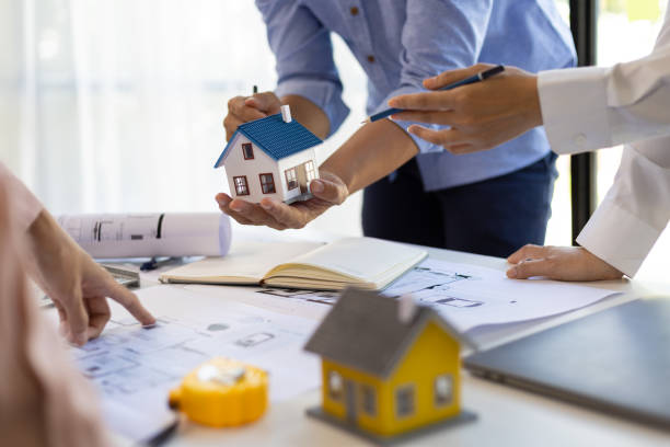istock Group of young architects colleagues brainstorm design work on blueprint planning ideas of construction projects. Construction engineering design inspector team working in the office. 1759846510