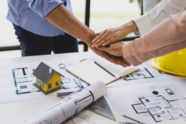 istock Handshake, Colleagues meeting in the office of architect and construction engineer working together to design a housing construction project. 1759847027