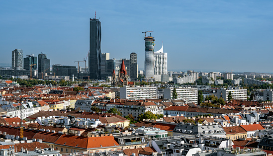 view from the ferries wheel in the Viennese fairground Prater north across the district Mariahilf onto the high-rise buildings of the Danube city and the New Danube, Austria