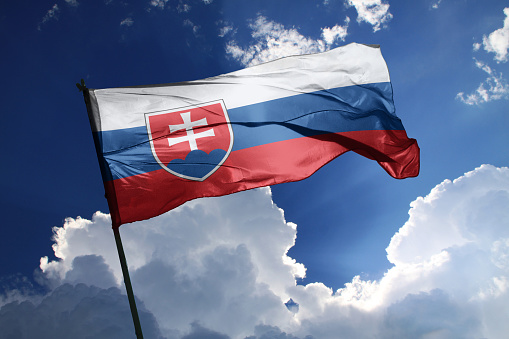 3d illustration flag of Slovakia. Slovakia flag isolated on the blue sky with clipping path.