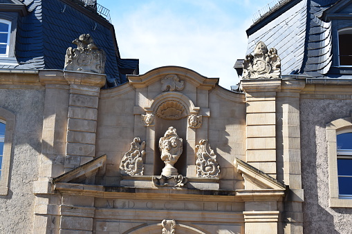 Echternach, Luxembourg - 09/26/2023: Statue in an arch above a gate to a public administration building