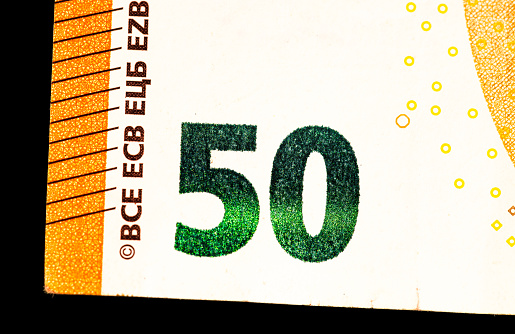 Fragment of a ten euro banknote close-up with denomination.