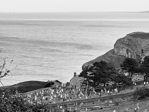Looking down on a cemetery on the rugged North Wales coastline