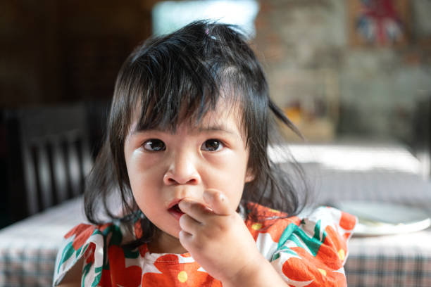 istock A cute baby eating meal. 1759866254