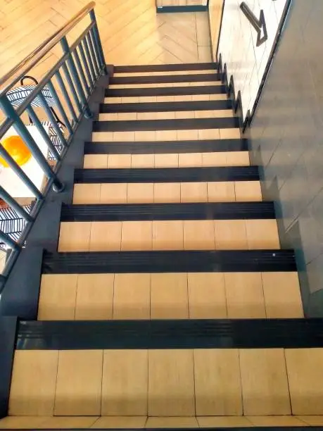 Steps with a stainless-steel handrail and glass
