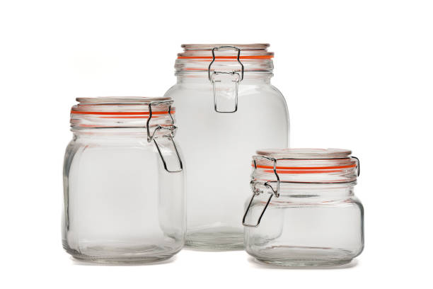 istock Three glass jars with tight-fitting lids for bulk products on a white background. 1759900745