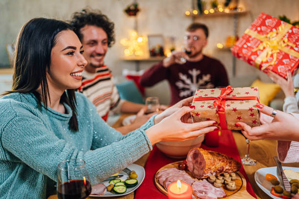 istock Friends exchanging Christmas presents 1759902834