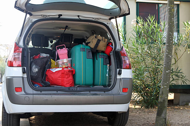Monica Four Pekkadillo 487 Car Full Of Luggage Stock Photos, Pictures & Royalty-Free Images -  iStock | Lots of luggage, Pink convertible, Back of car driving away