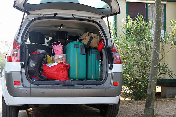 Car full of suitcases and bags Car full of suitcases and bags before leaving for summer vacation car trunk stock pictures, royalty-free photos & images