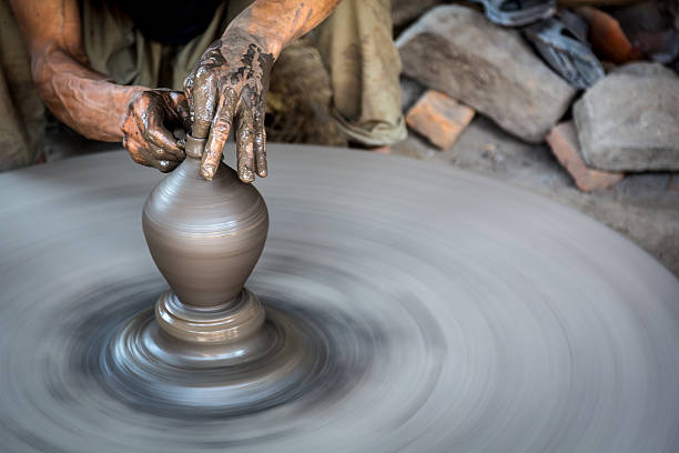Man artist making pottery in Nepal