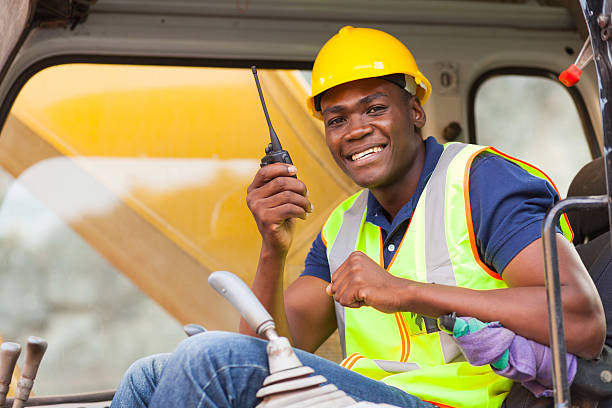 istock african bulldozer operator talking on walkie talkie 175991211
