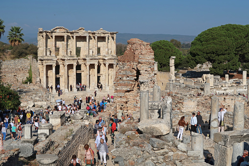 Ephesus, Turkey, October 17, 2023. Ancient ruined city of Ephesus, near Port of Kusadasi. Area of detail featuring the Library of Celsus with large numbers of tourists. Outdoors on a sunny day