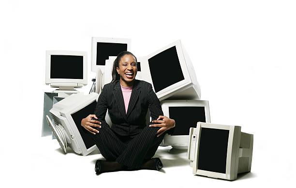 istock Woman surrounded by screens 175993707
