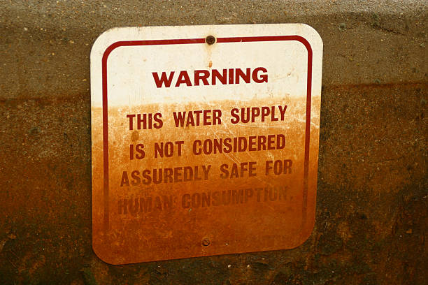 istock Red and white faded warning sign about contaminated water 175994140