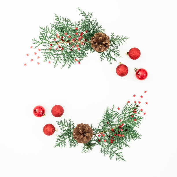 istock Merry Christmas frame composition with tree branches and red balls with confetti on white background. Flat lay, top view 1759941559