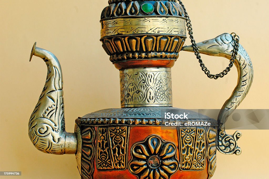 Intricate Craftsmanship An intricately done copper, white metal alloy vessel. An example of ethnic Indian handicraft. Alloy Stock Photo