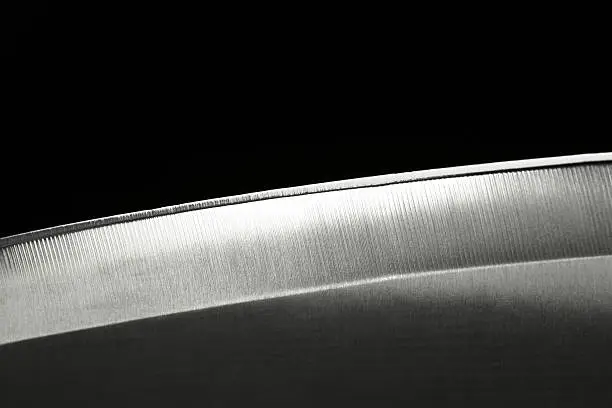 "Closeup shot of a knife blade, isolated on black background.Similar images -"