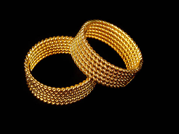 istock Gold rings against black background 175995109