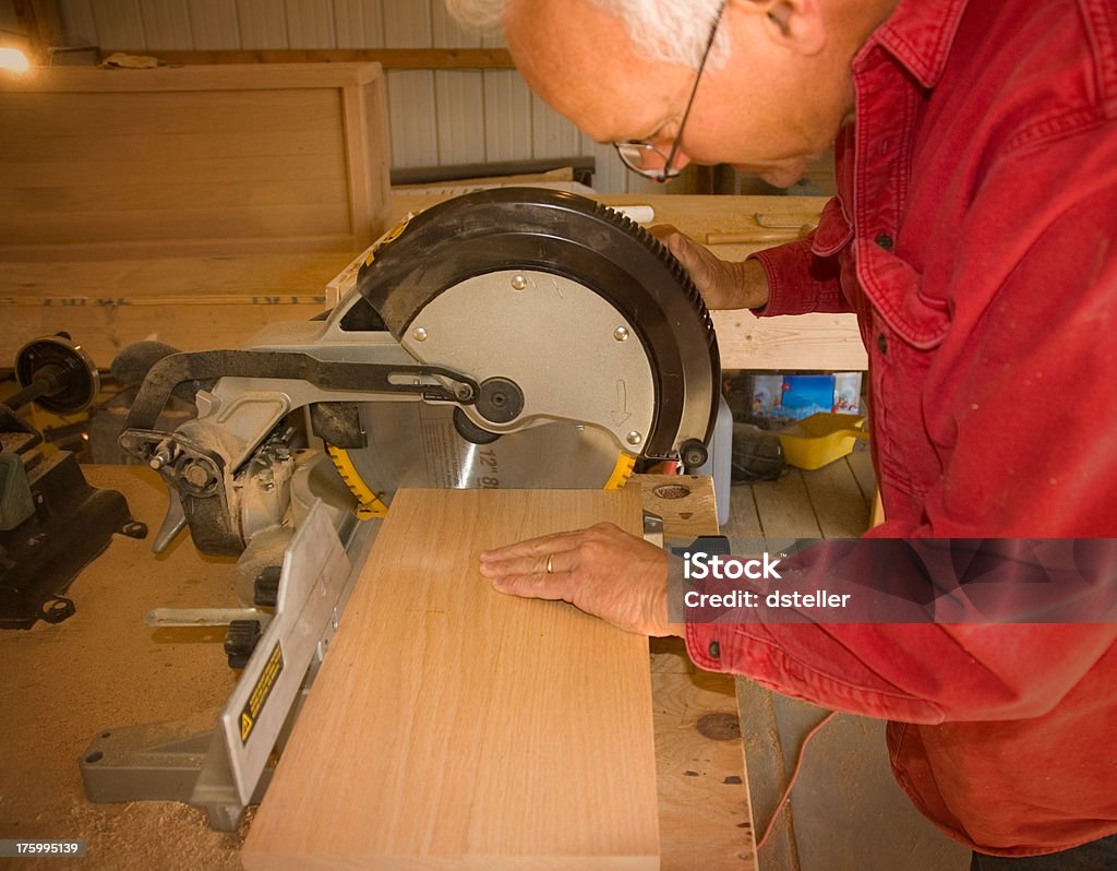 Carpenter Cutting a board  AARP Stock Photo