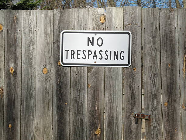 istock No Trespassing Sign on Fence 175995154