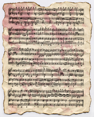 An antique page of sheet music with wine stains on it. (hi-res)Similar images: