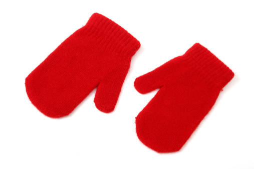 A pair of red winter mittens isolated on white.