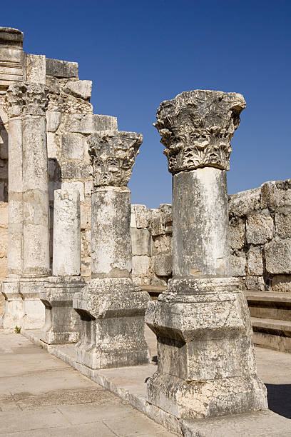 Capernaum "Columns of the synagogue at Capernaum, Israel. Jesus made his home here when he left Nazareth." jusus stock pictures, royalty-free photos & images