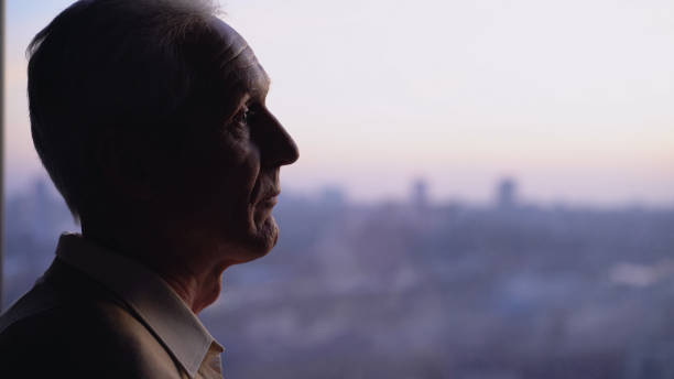 istock A pensive elderly man looking out the window, experiencing loneliness and health problems in his senior age 1759957083
