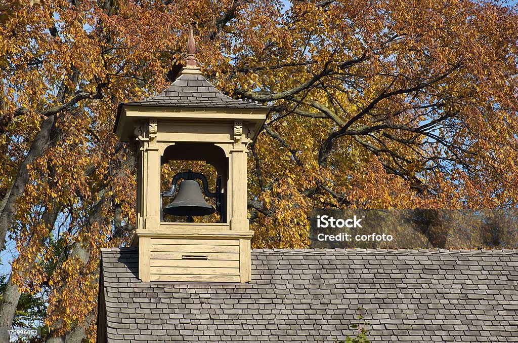School Bell "Historic school house bell with autumnal background in Greenfield Village Museum in Dearborn, Michigan, USA" Dearborn - Michigan Stock Photo