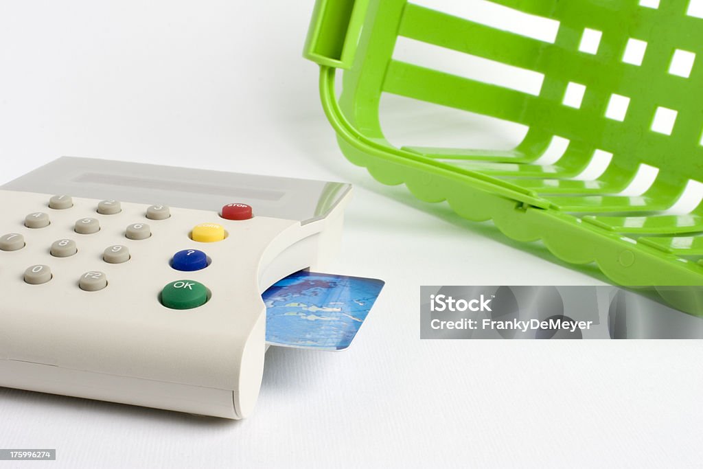 Green shopping basket and credit card Green shopping basket with pay terminal and credit card. ATM Stock Photo