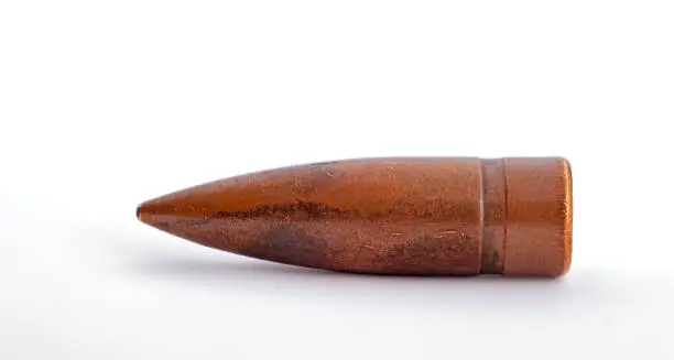 macro shoot of 7.62 caliber bullet on a white background
