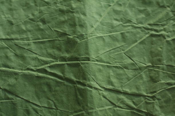 istock green crumpled paper texture, background 1759966758