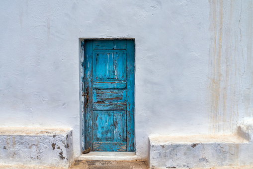 Blue door facade in Greece