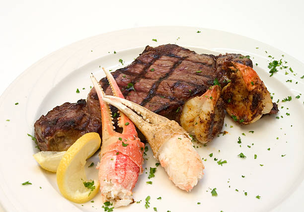 explore & turf - surf and turf prepared shrimp steak grilled fotografías e imágenes de stock